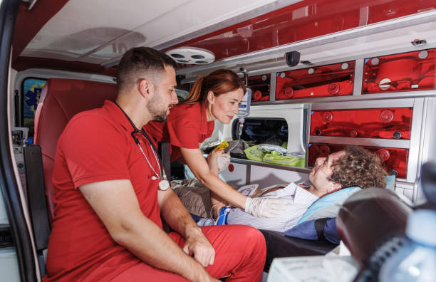 istock Paramedics supporting a patient in an ambulance 2159164246