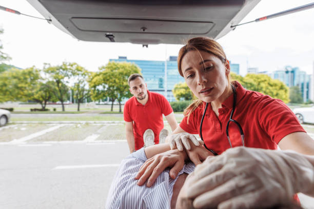 istock Emergency workers transporting a patient to hospital 2159164250