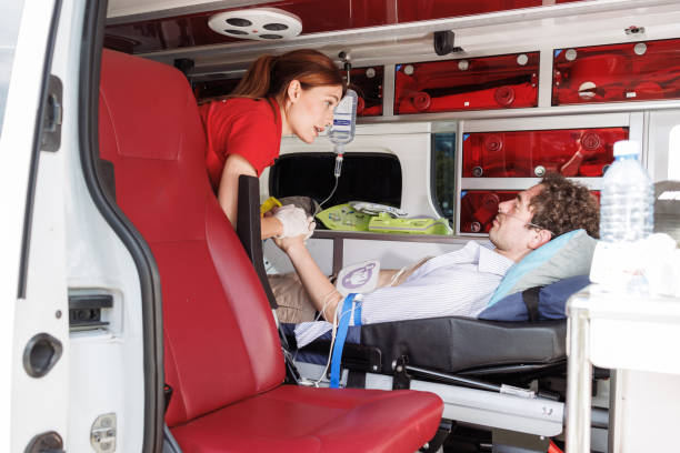 istock Paramedic assisting patient inside ambulance during emergency 2159164291