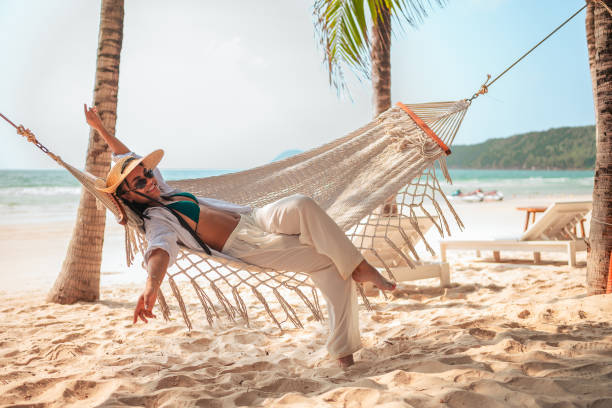 istock Relaxed Young Woman Enjoying Beach Hammock 2159165121