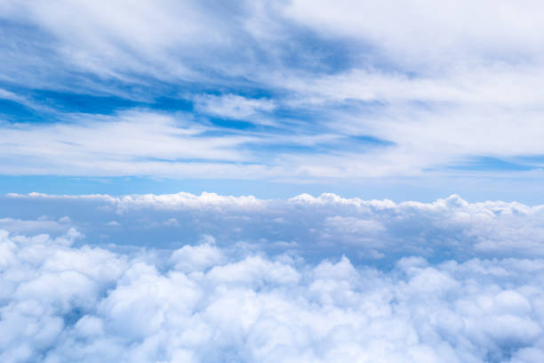 istock Early summer clouds and blue sky seen from an airplane 2159168623