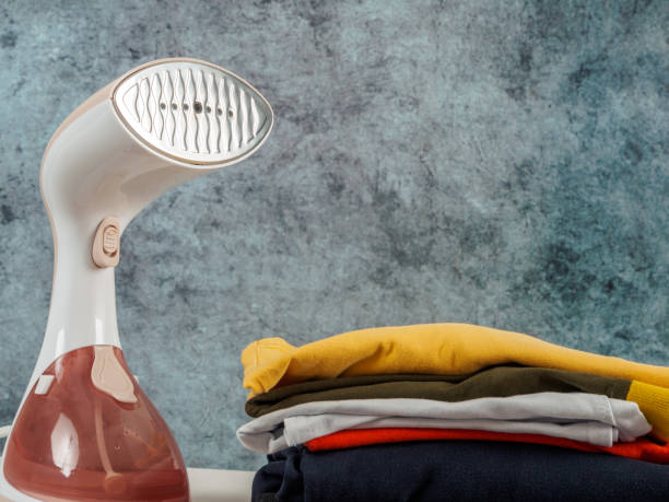 istock Steamer iron for ironing clothes close-up 2159170372