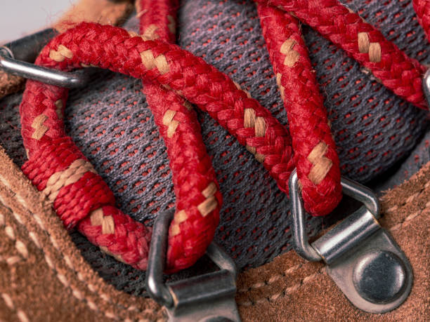 Laces on modern leather hiking boots, macro shot selective focus close-up