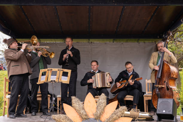 Austria, Bad Hofgastein - Oktober 26, 2023: Outdoor Musical Performance by a Folk Band in a Covered Stage