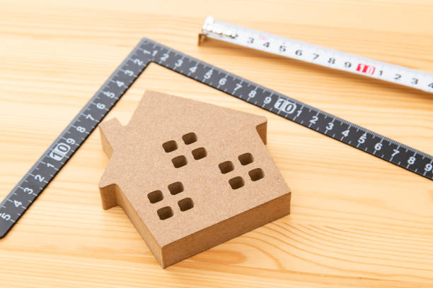 istock A square and a house object on a wood grain background 2159175929