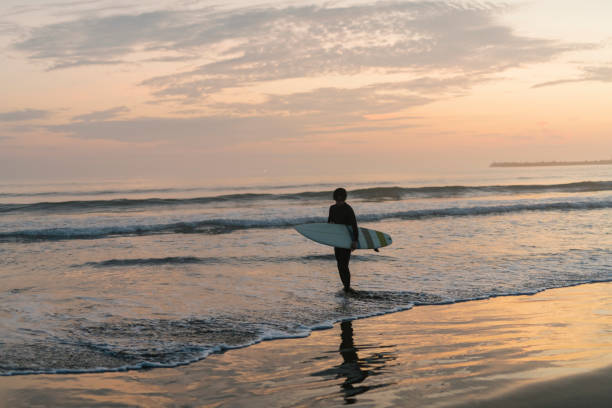istock Man surfing in the morning ocean. 2159178444