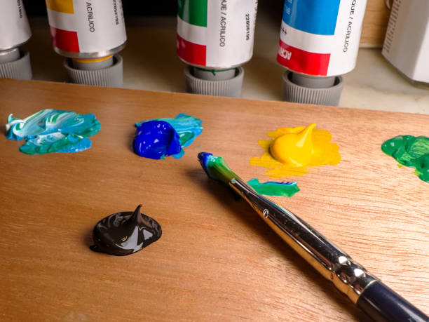 istock Artist's Palette with Paints and Brush in a Creative Workspace 2159178816