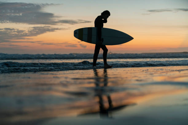 istock Man surfing in the morning ocean. 2159179106