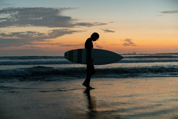 istock Man surfing in the morning ocean. 2159179629