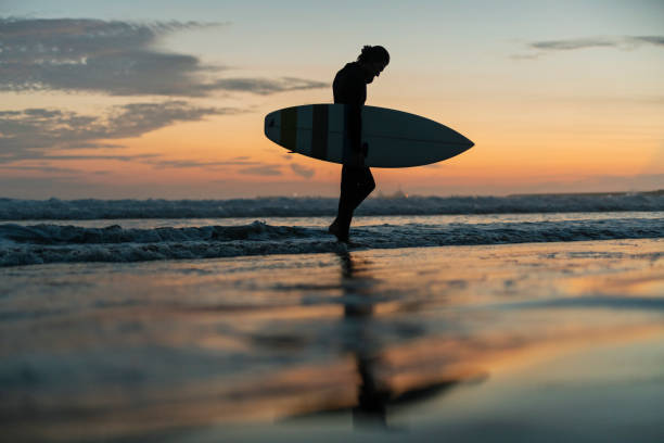 istock Man surfing in the morning ocean. 2159180426