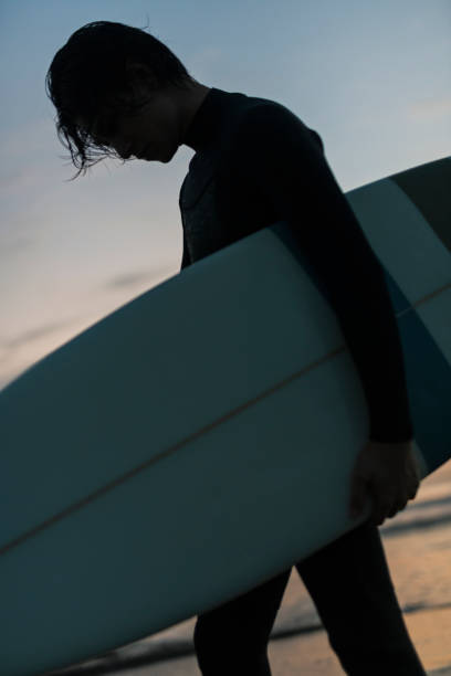 istock Man surfing in the morning ocean. 2159181156