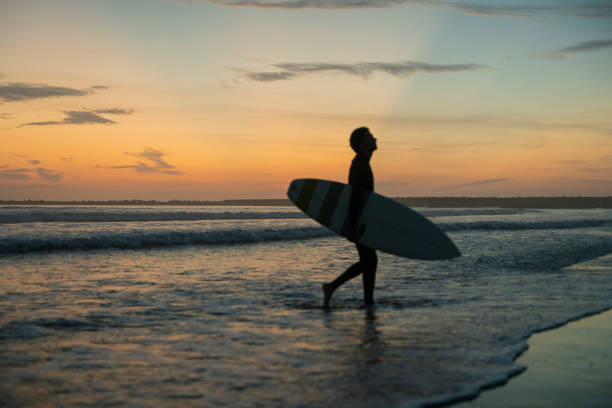 istock Man surfing in the morning ocean. 2159181417
