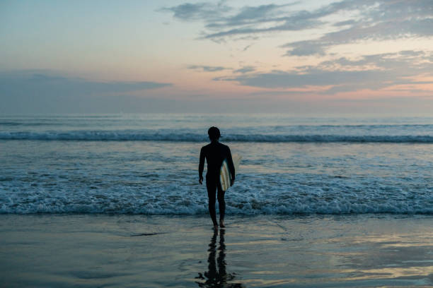 istock Man surfing in the morning ocean. 2159182282