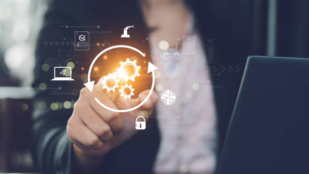 istock obotic Process Automation (RPA) technology to automate business tasks with AI. Concept with expert setting up automated software on laptop computer. Digital transformation and change management. 2159185801