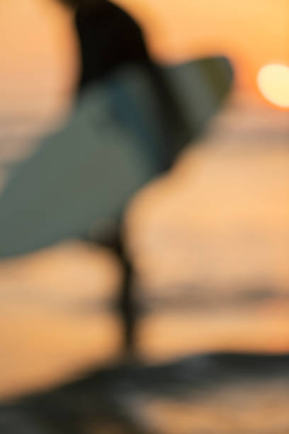 Man surfing in the morning ocean.
