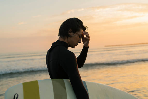 istock Man surfing in the morning ocean. 2159187076
