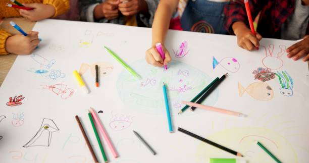 istock Children, friends and hands drawing for creative project or school academy for art class, learning or lesson. Pencils, colouring and paper or teamwork with childhood development, classroom or craft 2159187490