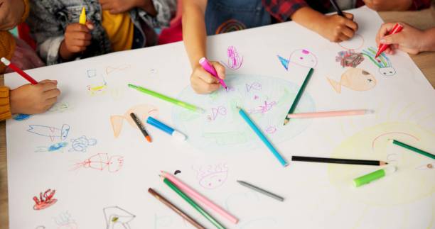 istock Children, friends and hands drawing for creative project or school academy for art class, learning or lesson. Pencils, colouring and paper or teamwork with childhood development, classroom or craft 2159187492
