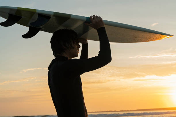istock Man surfing in the morning ocean. 2159188375