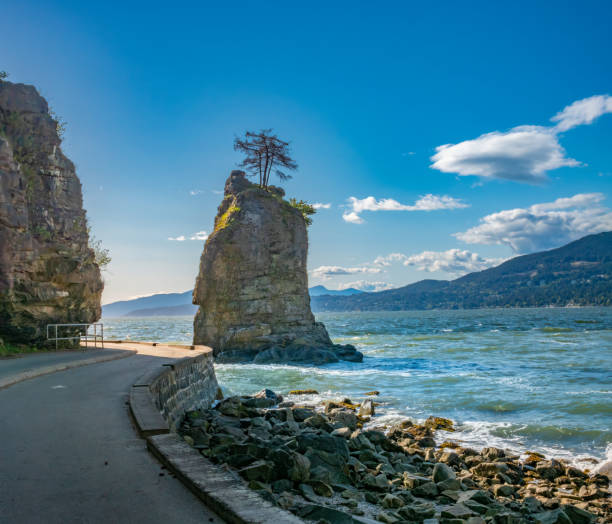The iconic Siwash Rock, Stanley Park Seawall Bike and walking path, Vancouver, British Columbia, Canada