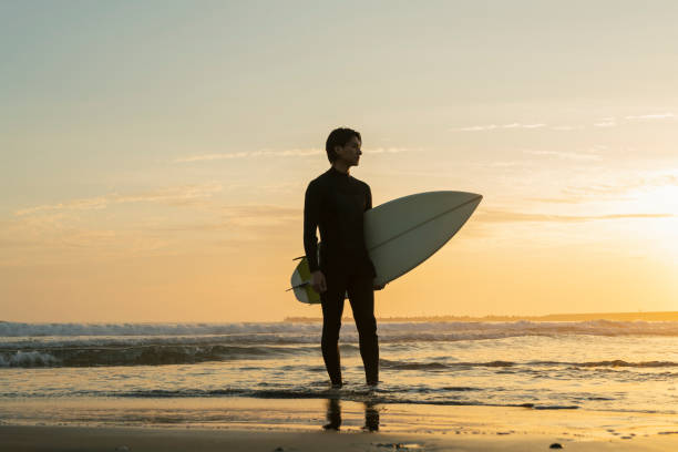 istock Man surfing in the morning ocean. 2159188701