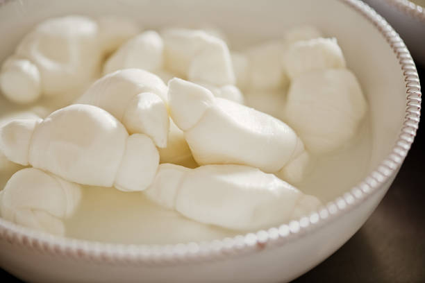 White ceramic bowl of artisan fresh mozzarella  for a dinner in Puglia, Italy