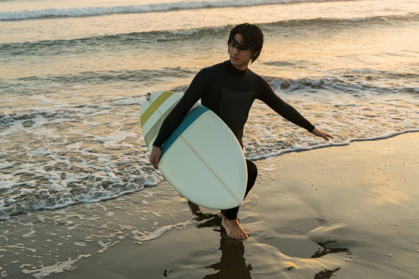istock Man surfing in the morning ocean. 2159189291