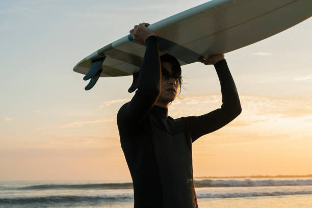 istock Man surfing in the morning ocean. 2159189904