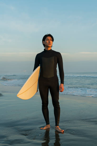 istock Man surfing in the morning ocean. 2159190100