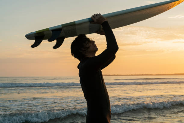 istock Man surfing in the morning ocean. 2159191030