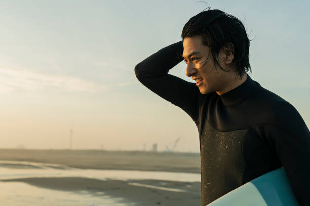 istock Man surfing in the morning ocean. 2159191788