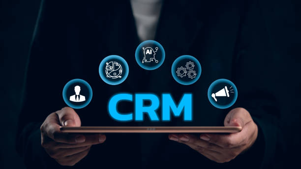 istock CRM concept with icons around a tablet, illustrating customer relationship management. Ideal for business strategy, marketing, sales, service automation. Digital integration solution. 2159200254
