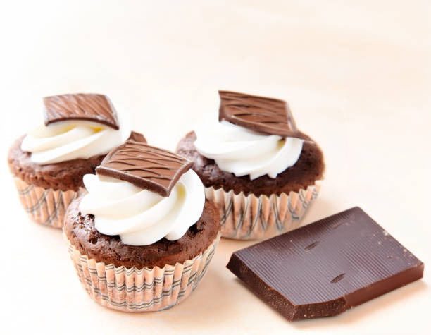 Close-up of a single mint cupcake isolated on white.