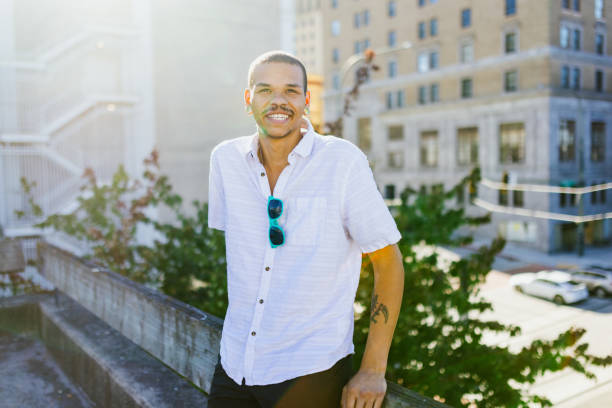 istock Cheerful Smiling Man In City Setting 2159207759