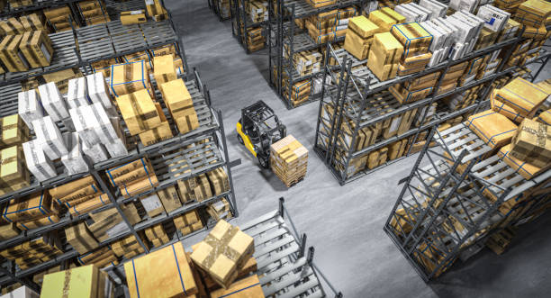 istock Forklift carrying pallet between rows of shelves 2159208680
