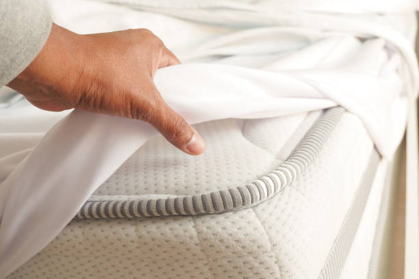istock Placing the white sheet on the mattress for added comfort 2159214300