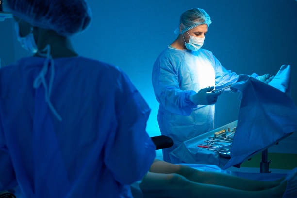 istock Doctor preparing for plastic surgery checking sterile equipment 2159218699