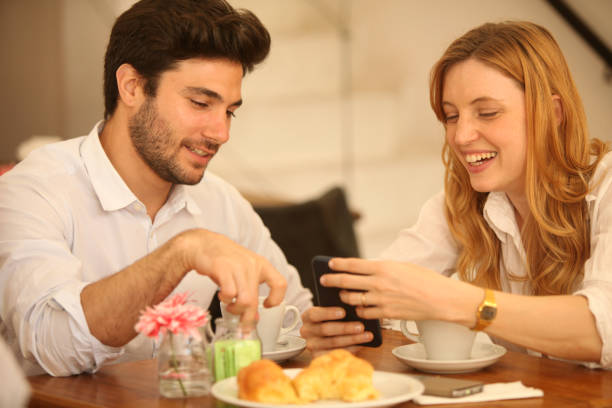 istock Happy your beautiful couple having fun and drinking coffee 2159221438