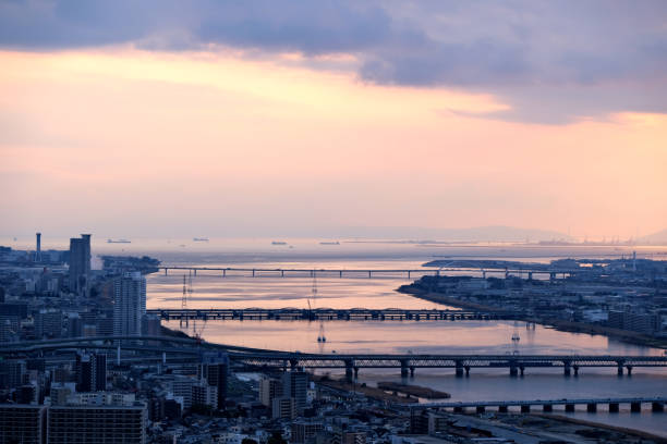 View of Osaka cityscape and the Yodo river at sunset, Japan.