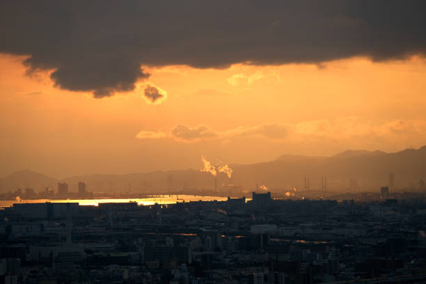 Harbour view and Osaka cityscape at sunset, viewed from the Umeda Sky Building, a two-tower landmark skyscraper height 170 mt, located in the outskirts of Umeda business district in Kita-ku, Osaka.