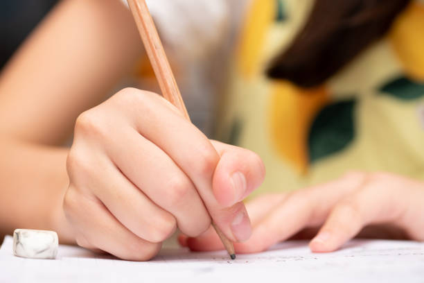 istock The hands of a child studying 2159224574