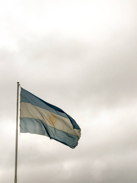 istock Argentine flag flaming over a cloudy sky 2159231803
