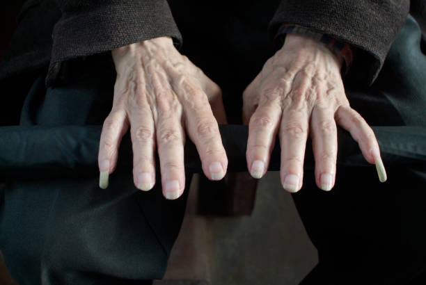 istock Hands of old man with long nails 2159232942