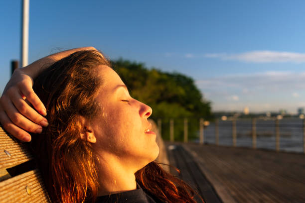 portrait of beautiful girl in the sunlight at sunset