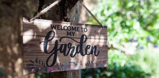 istock Garden welcome sign with mediterranean courtyard as background 2159237012