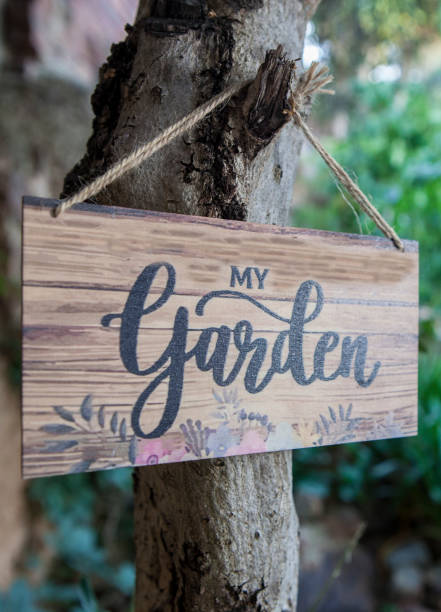 istock Garden welcome sign with mediterranean courtyard as background 2159237016