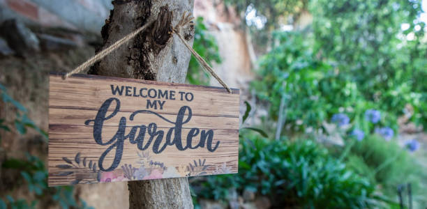istock Garden welcome sign with mediterranean courtyard as background 2159237020