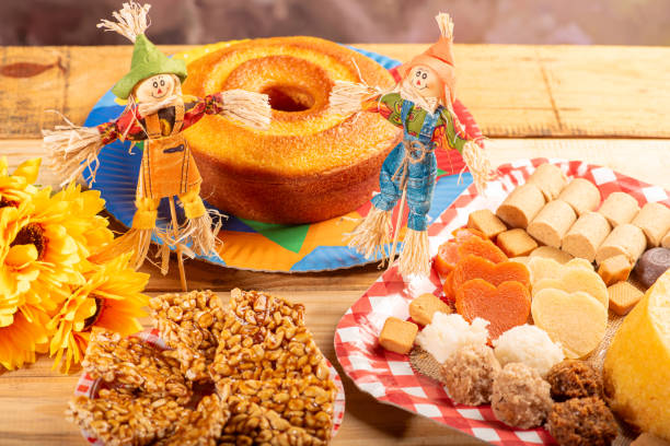 istock Festa Junina, straw dolls in front and in the blurred background a table full of sweets from the Brazilian Festa Junina, selective focus. 2159238515
