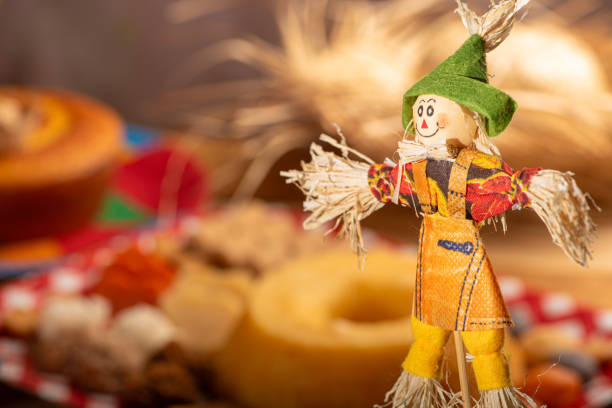 istock Festa Junina, straw dolls in front and in the blurred background a table full of sweets from the Brazilian Festa Junina, selective focus. 2159238832