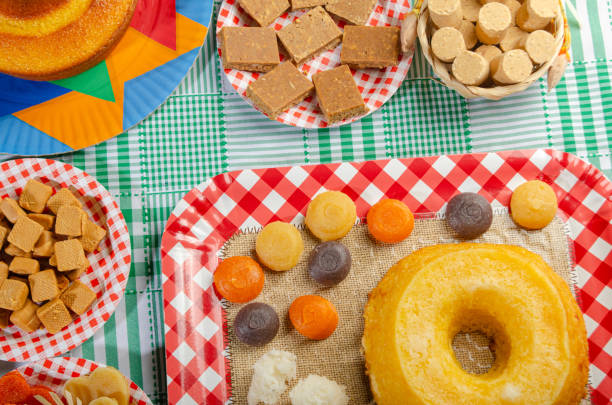 istock Festa Junina, beautiful rustic table with dishes containing various types of sweets for Festa Junina in Brazil, top view. 2159239619